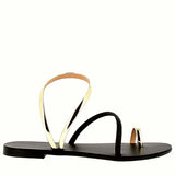 Sandal in shiny gold and black leather