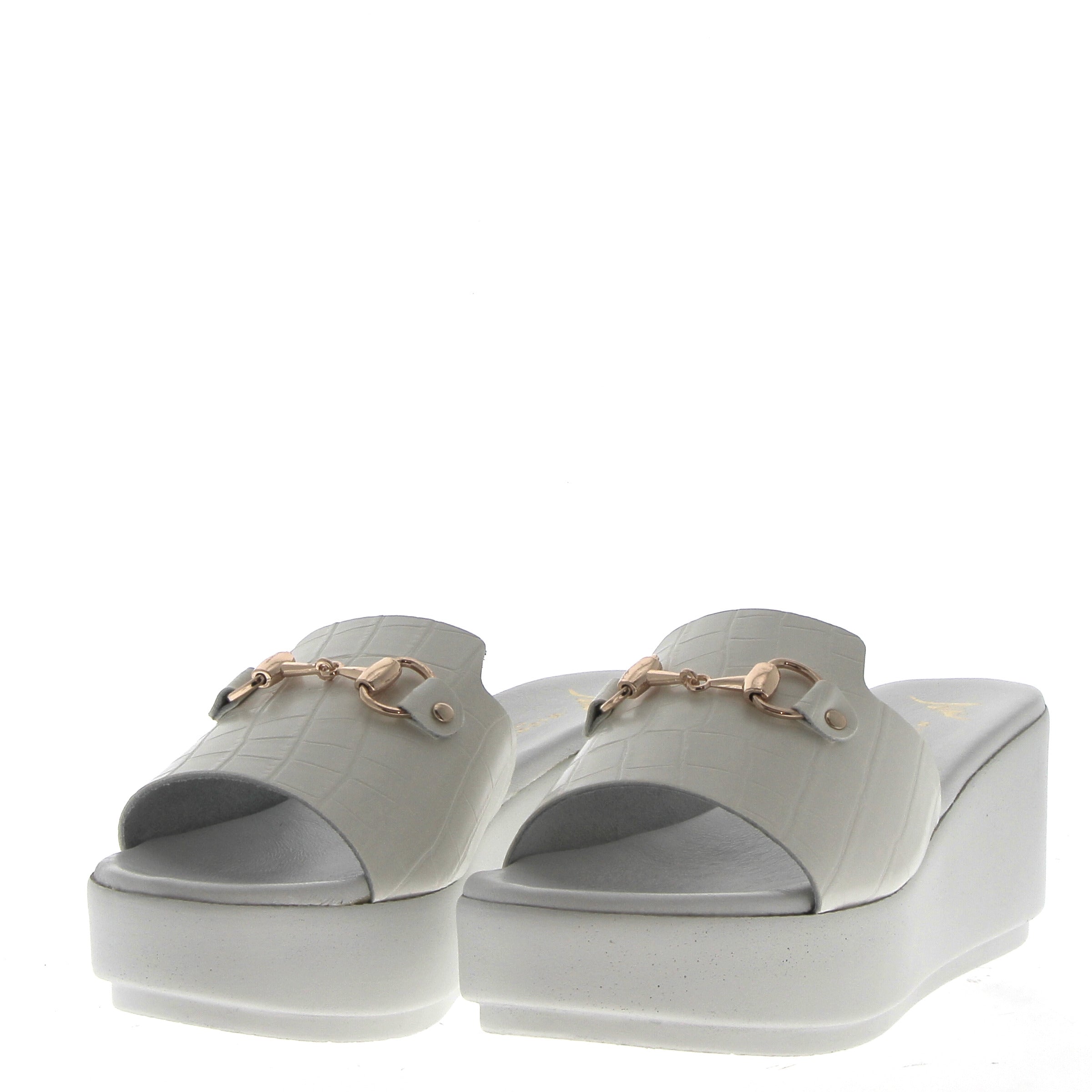 White sandal on light wedge with coconut finish